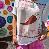 Washed white tee with pink and red checkered graphic paired with a fiery pepper design.