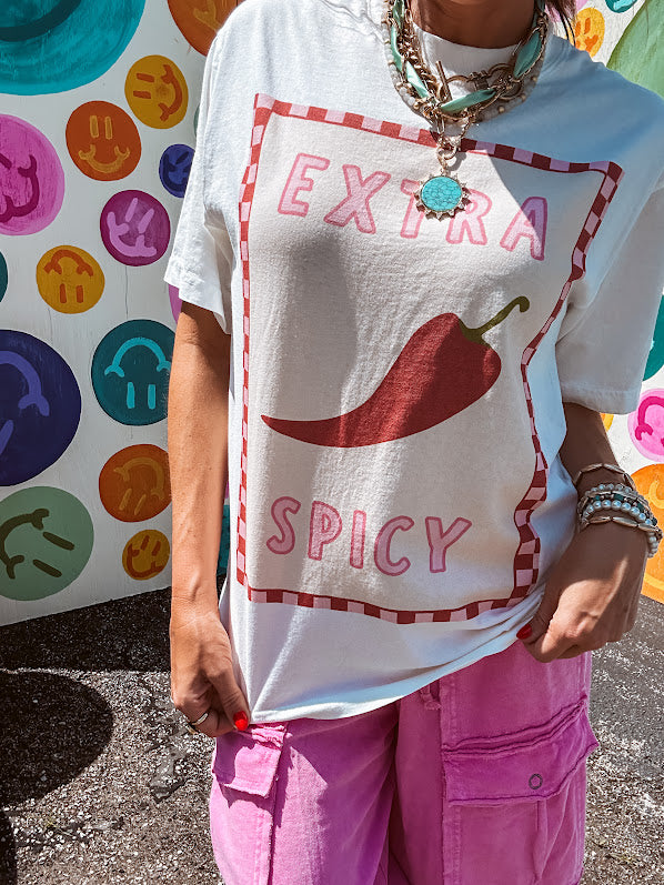 Washed white tee with pink and red checkered graphic paired with a fiery pepper design.
