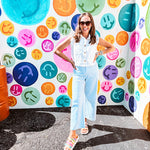 A crisp white twill vest that's equal parts polished and playful—those ruffled sleeves are the kind of detail that makes every outfit feel intentional. Button-down front, collar, and functional pockets.
