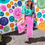 Cotton terry wide leg pants in mineral washed bubble gum pink with elastic drawstring waist, oversized pockets and raw seams.