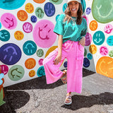 Cotton terry wide leg pants in mineral washed bubble gum pink with elastic drawstring waist, oversized pockets and raw seams.