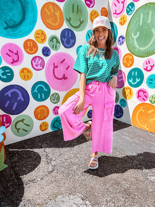 Cotton terry wide leg pants in mineral washed bubble gum pink with elastic drawstring waist, oversized pockets and raw seams.