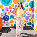 Buttery yellow sleeveless collared tank with V-neck design and structured collar and fully lined bodice and bubble hem.