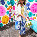 Cream fitted blazer with vibrant floral embroidery and French embroidered —"j'taime," "amour," "bisou, bisou"—with structured shoulder padding and scrunched sleeves.