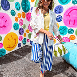 Cream fitted blazer with vibrant floral embroidery and French embroidered —"j'taime," "amour," "bisou, bisou"—with structured shoulder padding and scrunched sleeves.