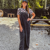Cotton washed black jumpsuit with adjustable straps and wide leg design