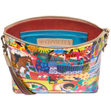 Consuela downtown crossbody with zipper closure and bold, multi colored Consuela fabric exterior with animal, plant, sun and moon artwork.