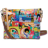 Consuela downtown crossbody with zipper closure and bold, multi colored Consuela fabric exterior with animal, plant, sun and moon artwork.