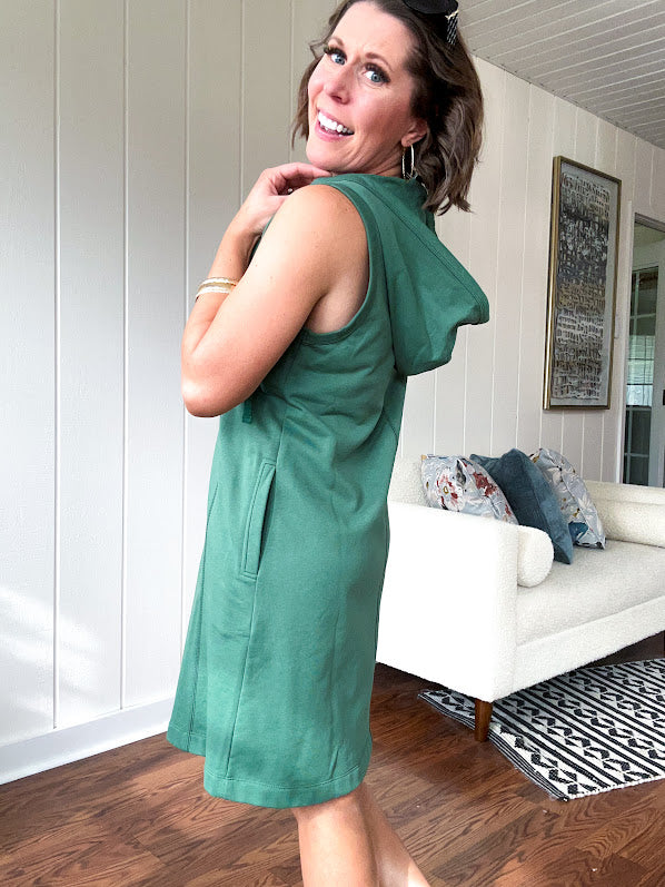 Terry-like forest green sleeveless hoodie dress with drawstring. Mini length.