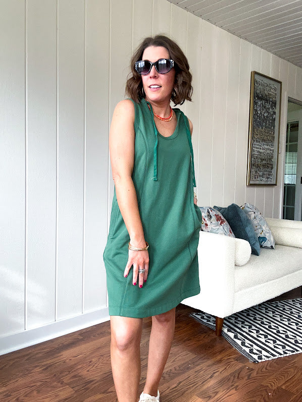 Terry-like forest green sleeveless hoodie dress with drawstring. Mini length.