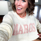 Nearly sheer soft, woven cream sweater with coral "MARGS" on the front.
