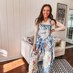 Denim patchwork overalls with tied adjustable straps, lace tied sides and floral and butterfly patches throughout.