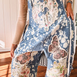 Denim patchwork overalls with tied adjustable straps, lace tied sides and floral and butterfly patches throughout.