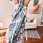 Denim patchwork overalls with tied adjustable straps, lace tied sides and floral and butterfly patches throughout.