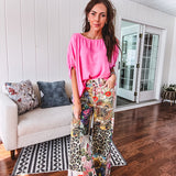 Cotton wide leg pants featuring an elastic back, button zipper closure and bright floral, bee and leopard print patchwork throughout with sparkling embellishments.