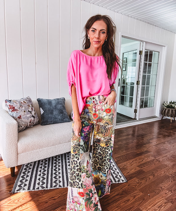Cotton wide leg pants featuring an elastic back, button zipper closure and bright floral, bee and leopard print patchwork throughout with sparkling embellishments.