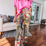 Cotton wide leg pants featuring an elastic back, button zipper closure and bright floral, bee and leopard print patchwork throughout with sparkling embellishments.