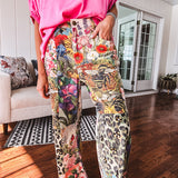 Cotton wide leg pants featuring an elastic back, button zipper closure and bright floral, bee and leopard print patchwork throughout with sparkling embellishments.
