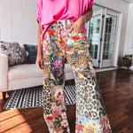 Cotton wide leg pants featuring an elastic back, button zipper closure and bright floral, bee and leopard print patchwork throughout with sparkling embellishments.