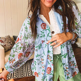 Lightweight denim blue button down blouse with sheer, long sleeves, vintage floral print.