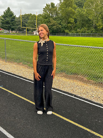 Black textured wide leg lounge pants with elastic waist.