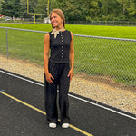 Textured black knit sleeveless top with wooden buttons down the front.