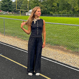 Textured black knit sleeveless top with wooden buttons down the front.