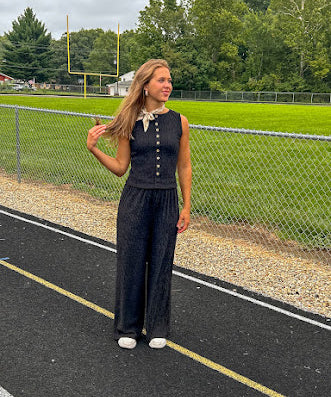 Black textured wide leg lounge pants with elastic waist.