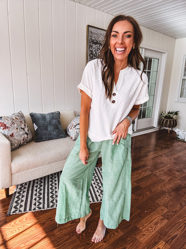 Lightweight green and white wide leg pants with elastic drawstring waist.