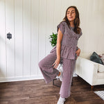 Plum and white gingham set with round neck top with smocking detail throughout and scalloped short sleeves and elastic waist wide leg pants with scalloped hem.