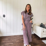 Plum and white gingham set with round neck top with smocking detail throughout and scalloped short sleeves and elastic waist wide leg pants with scalloped hem.