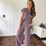 Plum and white gingham set with round neck top with smocking detail throughout and scalloped short sleeves and elastic waist wide leg pants with scalloped hem.