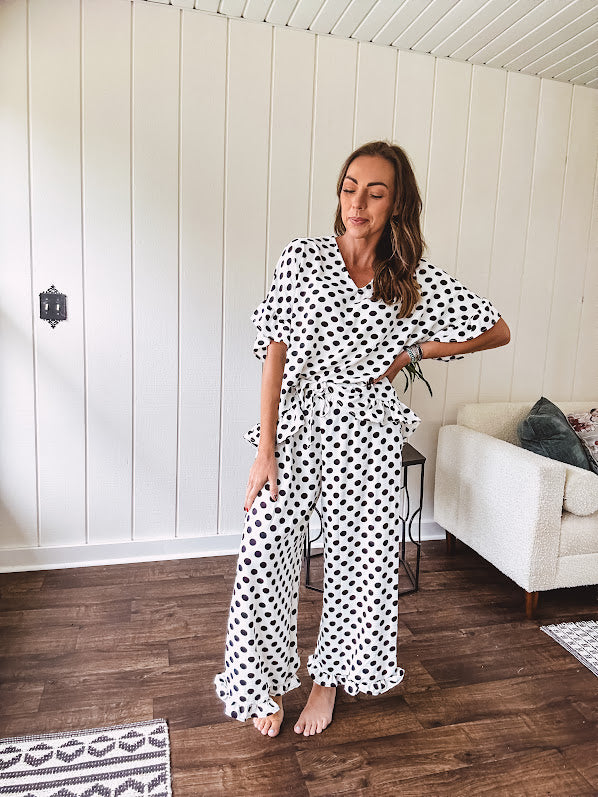 Lightweight, flowy wide leg pants with elastic drawstring waist and ruffled cuffs.