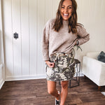 Camo terry knit mini skirt with crochet patchwork, drawstring waist, side pockets an zipper pocket.