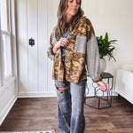 Lightweight button front camo jacket with olive and mustard colorway textured waffle weave on the sleeves and pockets, collar, metal buttons and tiny floral rivets throughout.