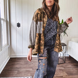 Lightweight button front camo jacket with olive and mustard colorway textured waffle weave on the sleeves and pockets, collar, metal buttons and tiny floral rivets throughout.