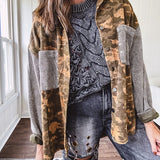 Lightweight button front camo jacket with olive and mustard colorway textured waffle weave on the sleeves and pockets, collar, metal buttons and tiny floral rivets throughout.