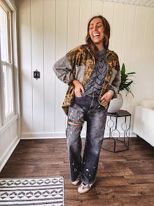 Lightweight button front camo jacket with olive and mustard colorway textured waffle weave on the sleeves and pockets, collar, metal buttons and tiny floral rivets throughout.