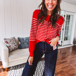 Lightweight red and pink horizontal striped button down long sleeved cardigan.