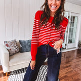 Lightweight red and pink horizontal striped button down long sleeved cardigan.