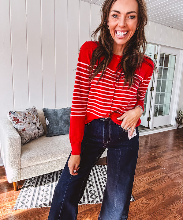 Lightweight red and pink horizontal striped button down long sleeved cardigan.