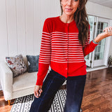 Lightweight red and pink horizontal striped button down long sleeved cardigan.