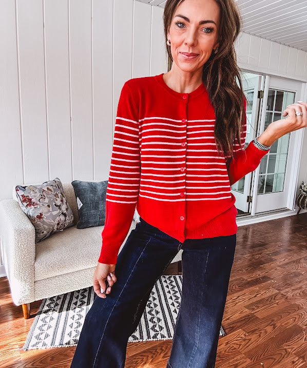 Lightweight red and pink horizontal striped button down long sleeved cardigan.