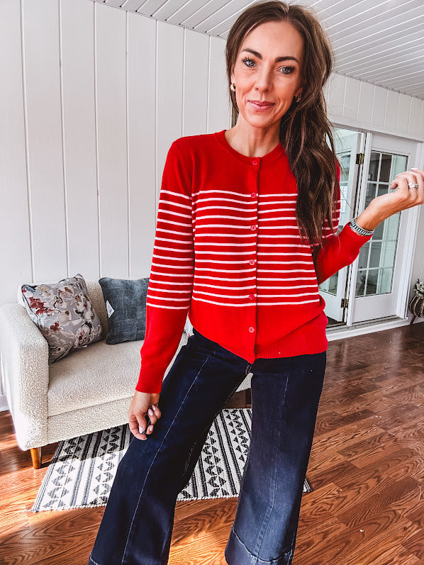 Lightweight red and pink horizontal striped button down long sleeved cardigan.