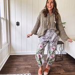Chenille-like woven long sleeved sweater in light olive green with hoodie and matching rope ties with relaxed hem and fit.