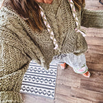 Chenille-like woven long sleeved sweater in light olive green with hoodie and matching rope ties with relaxed hem and fit.