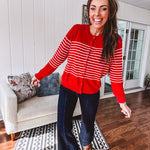 Lightweight red and pink horizontal striped button down long sleeved cardigan.