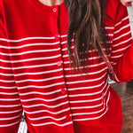 Lightweight red and pink horizontal striped button down long sleeved cardigan.