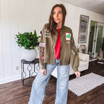 Olive classic bomber jacket with western inspired patchwork and embroidery throughout with zip up front and elastic waist, collar and cuffs.