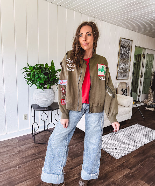 Olive classic bomber jacket with western inspired patchwork and embroidery throughout with zip up front and elastic waist, collar and cuffs.